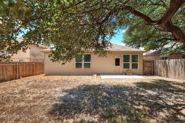 9008 Tall Sky Trce, Austin, TX 78724 - back of house with a fenced backyard and a patio area