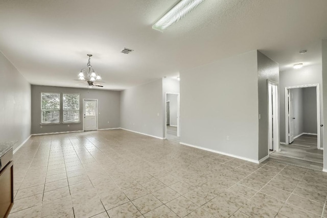 9008 Tall Sky Trce, Austin, TX 78724 - empty room with a chandelier and baseboards