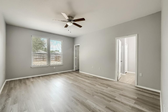 9008 Tall Sky Trce, Austin, TX 78724 - unfurnished room with ceiling fan, wood finished floors, and baseboards