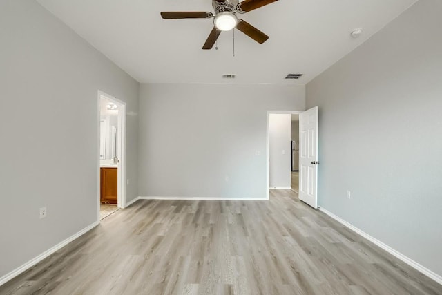 9008 Tall Sky Trce, Austin, TX 78724 - spare room featuring light wood finished floors, a ceiling fan, and baseboards