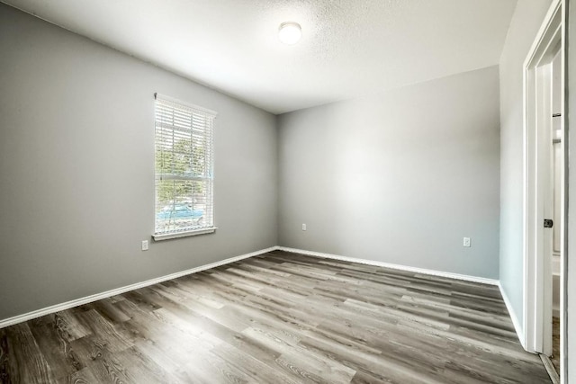 9008 Tall Sky Trce, Austin, TX 78724 - unfurnished room featuring wood finished floors and baseboards