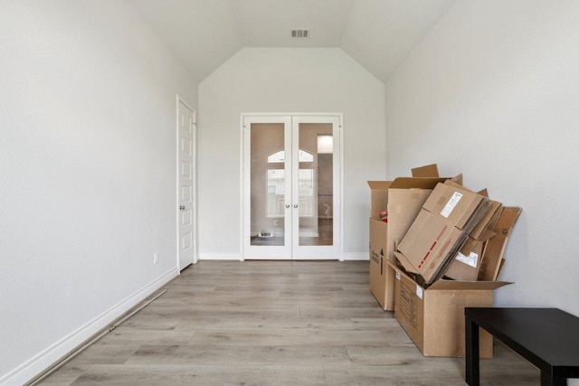 13212 Carol Lawler Ln, Manor, TX 78653 - corridor with french doors, wood finished floors, and vaulted ceiling
