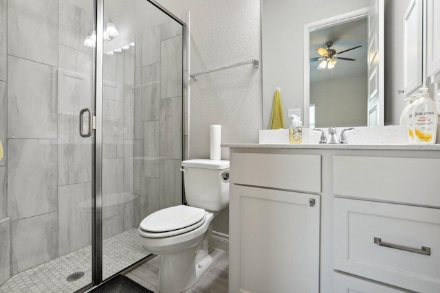 13212 Carol Lawler Ln, Manor, TX 78653 - full bathroom featuring a ceiling fan, vanity, a shower stall, and a textured wall