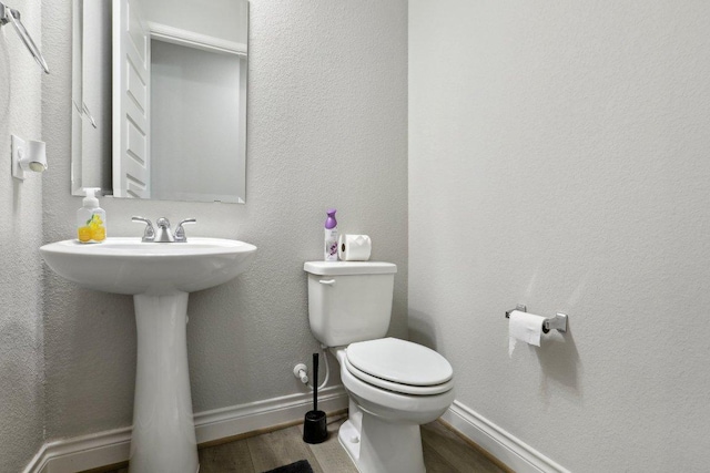 13212 Carol Lawler Ln, Manor, TX 78653 - bathroom featuring wood finished floors and toilet
