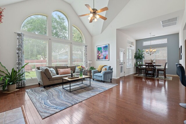 9905 Palmbrook Dr, Austin, TX 78717 - living room with high vaulted ceiling, hardwood / wood-style flooring, a chandelier, ceiling fan, and baseboards