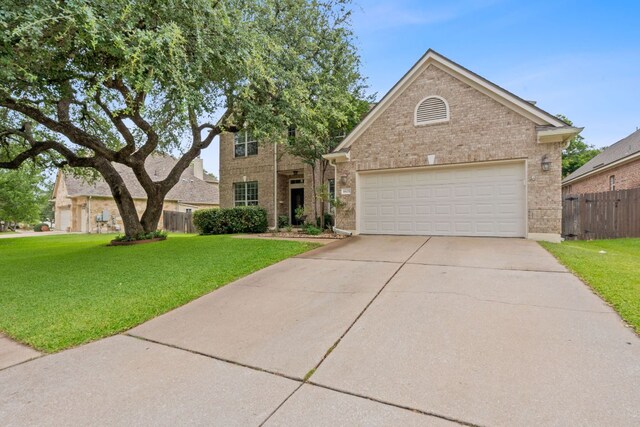 9905 Palmbrook Dr, Austin, TX 78717 - traditional home featuring brick siding, concrete driveway, and an attached garage