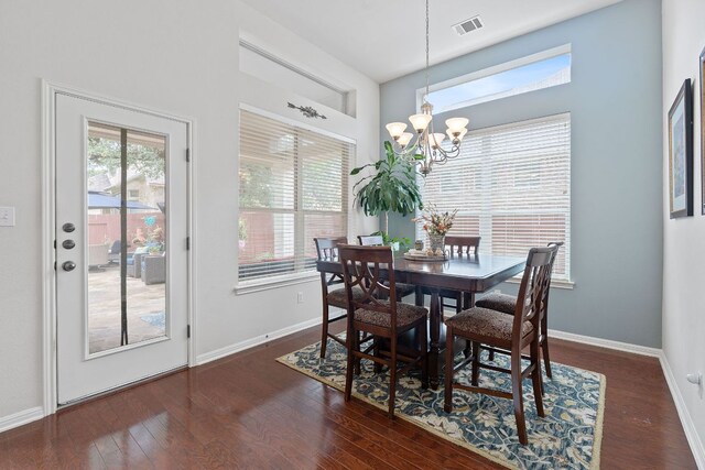 9905 Palmbrook Dr, Austin, TX 78717 - dining room with a chandelier, plenty of natural light, wood finished floors, baseboards, and a high ceiling