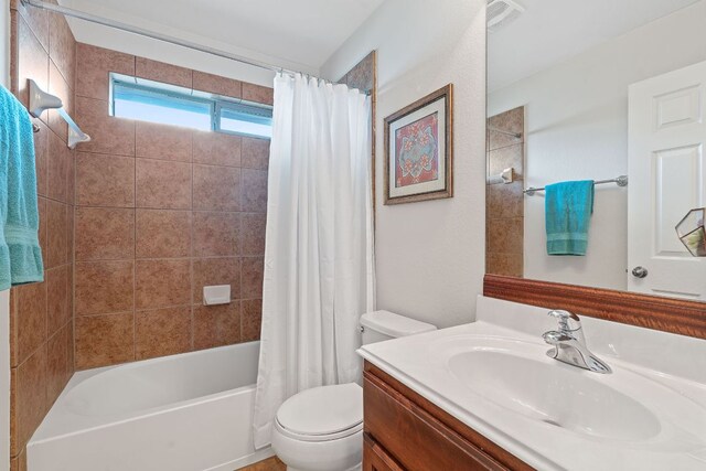 9905 Palmbrook Dr, Austin, TX 78717 - bathroom with vanity, toilet, and shower / bathtub combination with curtain