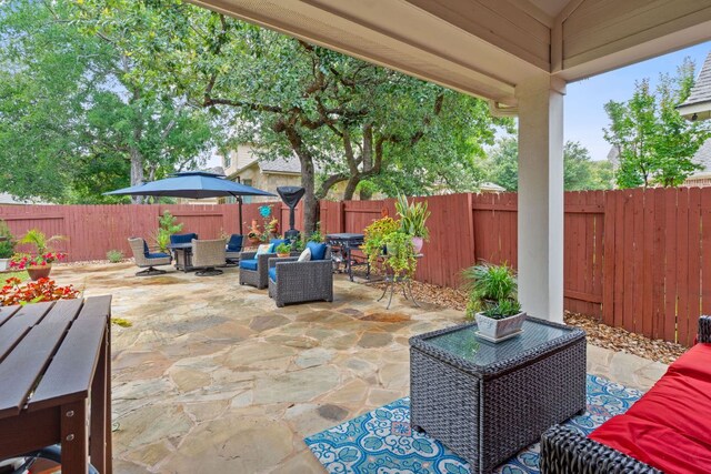 9905 Palmbrook Dr, Austin, TX 78717 - fenced backyard with outdoor dining area, a patio, and an outdoor hangout area