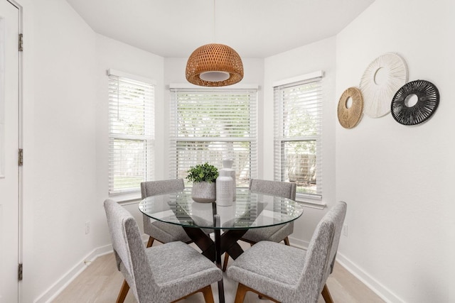 8005 Willet Trl, Austin, TX 78745 - dining area with light wood-type flooring and baseboards