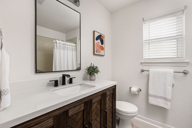 8005 Willet Trl, Austin, TX 78745 - full bathroom featuring vanity, toilet, and a shower with shower curtain