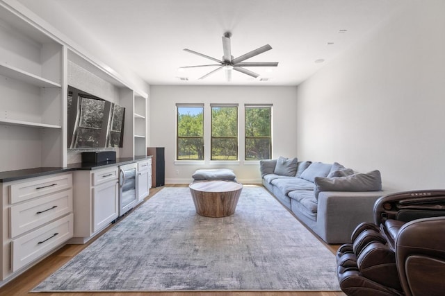 2908 Vista Heights Dr, Leander, TX 78641 - living area featuring ceiling fan, beverage cooler, and light wood-type flooring