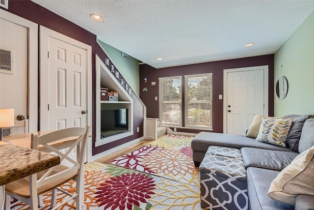 2000 Lightsey Rd Unit 3, Austin, TX 78704 - living area featuring a textured ceiling and recessed lighting