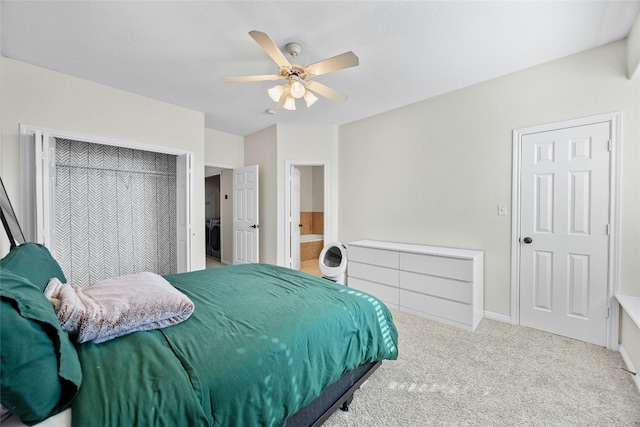 1101 E Parmer Ln Unit 305, Austin, TX 78753 - bedroom with carpet flooring, baseboards, ceiling fan, and washer / dryer