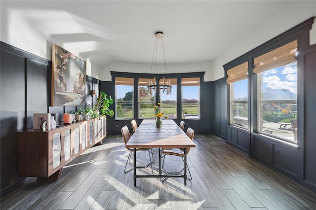 941 Linden Loop, Driftwood, TX 78619 - dining area with a chandelier, plenty of natural light, and dark wood finished floors