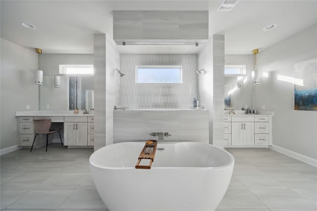 941 Linden Loop, Driftwood, TX 78619 - bathroom with a tile shower, a soaking tub, two vanities, and tile patterned floors