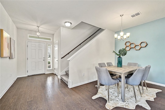 10612 Harwood Overlook Cv, Austin, TX 78747 - dining area with a chandelier, wood finished floors, and stairway