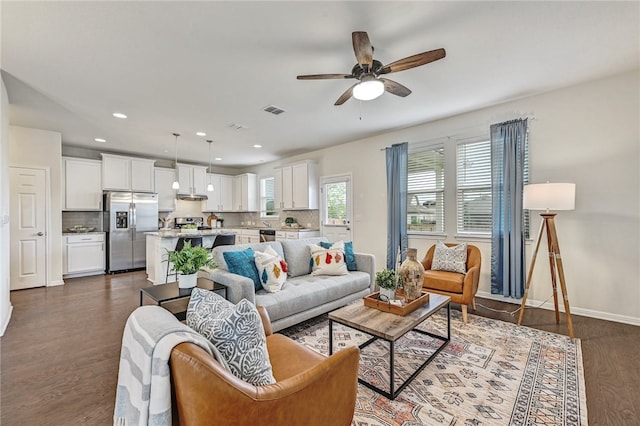 10612 Harwood Overlook Cv, Austin, TX 78747 - living area with dark wood-type flooring, ceiling fan, and recessed lighting