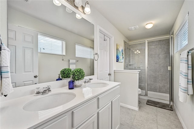 10612 Harwood Overlook Cv, Austin, TX 78747 - full bath with double vanity, tile patterned flooring, healthy amount of natural light, and a shower stall