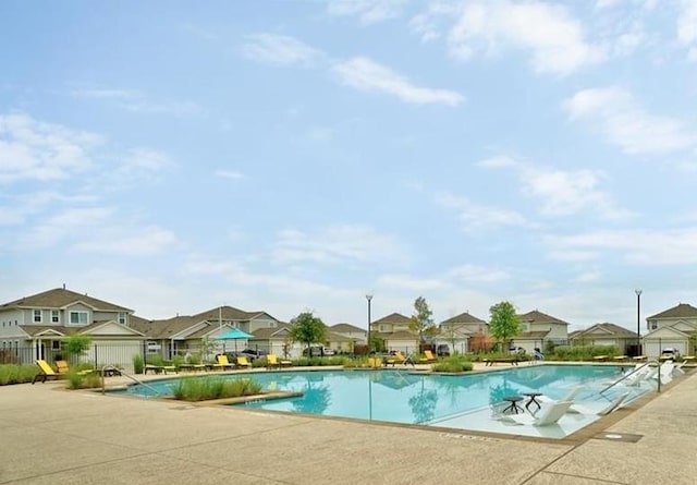 10612 Harwood Overlook Cv, Austin, TX 78747 - community pool featuring a residential view and a patio area
