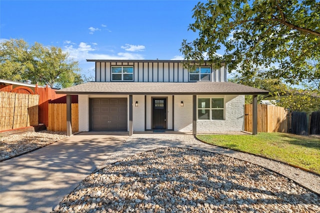 500 Arbor Ln, Austin, TX 78745 - view of front of home featuring brick siding, concrete driveway, covered porch, board and batten siding, and a garage