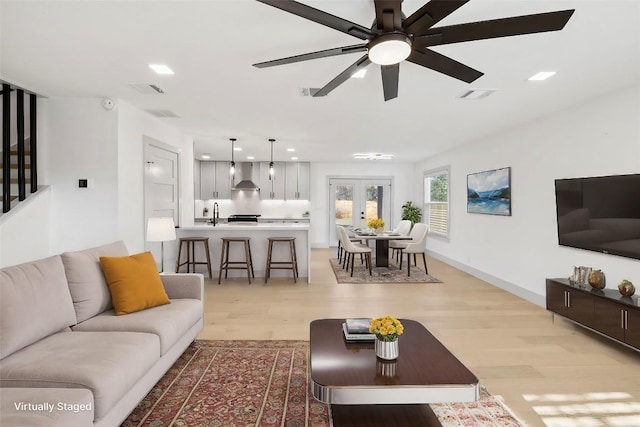 500 Arbor Ln, Austin, TX 78745 - living room featuring light wood-style floors and a ceiling fan