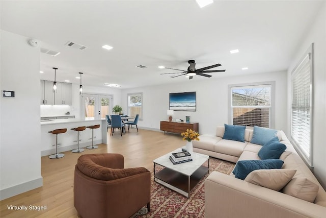 500 Arbor Ln, Austin, TX 78745 - living area with light wood-type flooring, recessed lighting, french doors, a ceiling fan, and baseboards