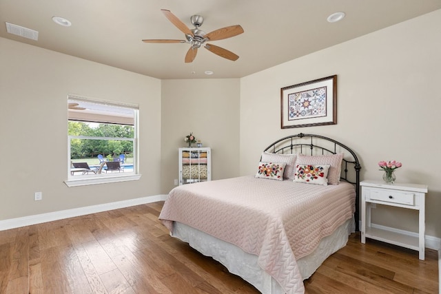 137 Lone Cypress Cv, Driftwood, TX 78619 - bedroom with baseboards, wood finished floors, recessed lighting, and ceiling fan