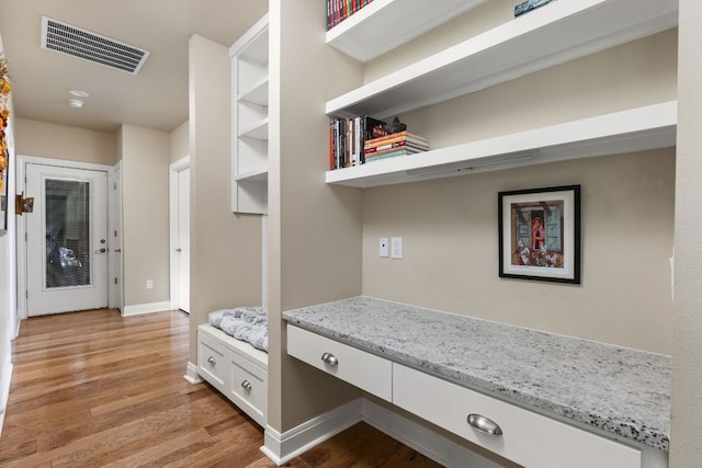 137 Lone Cypress Cv, Driftwood, TX 78619 - hallway featuring light wood-style floors and baseboards