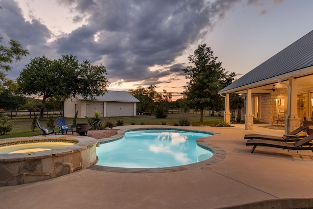 137 Lone Cypress Cv, Driftwood, TX 78619 - pool at dusk with a patio, ceiling fan, and a pool with connected hot tub