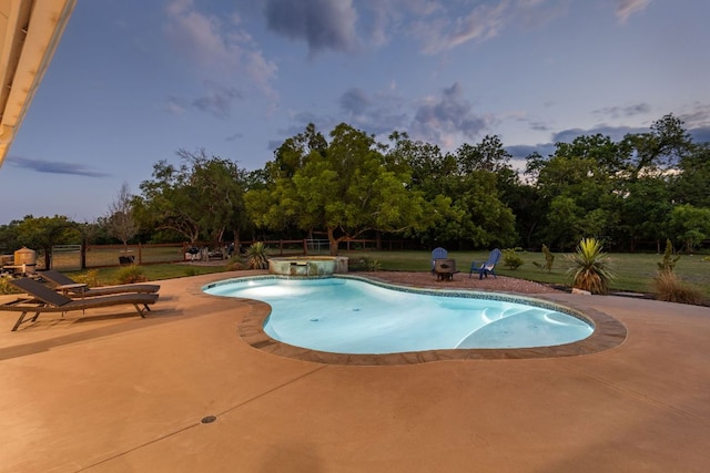 137 Lone Cypress Cv, Driftwood, TX 78619 - view of pool featuring a patio area, a pool with connected hot tub, and view of wooded area