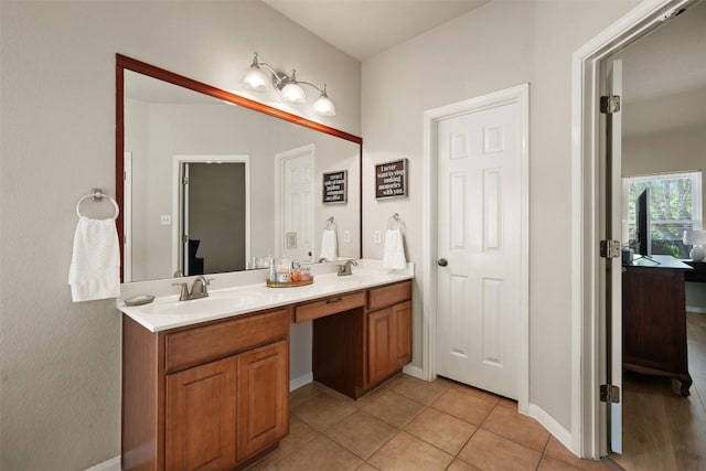 11113 Harvest Time Dr, Austin, TX 78754 - full bathroom featuring double vanity, tile patterned flooring, and baseboards