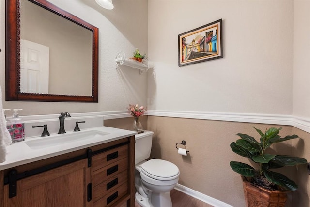 11113 Harvest Time Dr, Austin, TX 78754 - bathroom with toilet, vanity, and wood finished floors