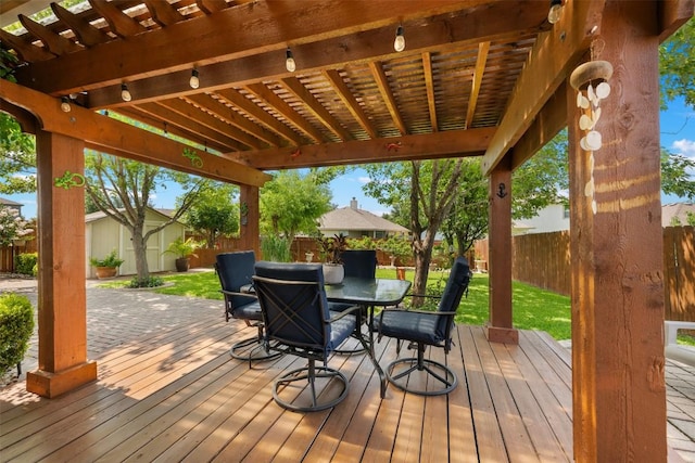 11113 Harvest Time Dr, Austin, TX 78754 - wooden terrace with outdoor dining area, a pergola, and a fenced backyard
