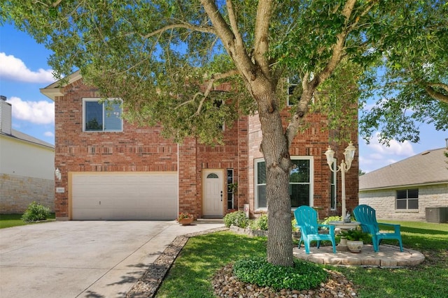 11113 Harvest Time Dr, Austin, TX 78754 - view of front facade featuring driveway, central AC, a garage, and brick siding