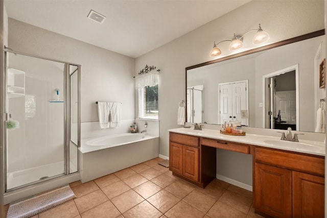 11113 Harvest Time Dr, Austin, TX 78754 - full bath with a stall shower, a bath, double vanity, and tile patterned floors