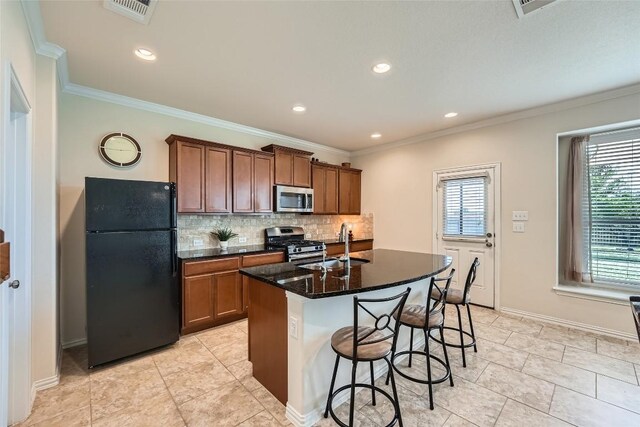 2712 Auburn Chestnut Ln, Pflugerville, TX 78660 - kitchen featuring appliances with stainless steel finishes, decorative backsplash, a breakfast bar area, brown cabinetry, and crown molding