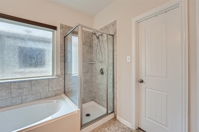 2712 Auburn Chestnut Ln, Pflugerville, TX 78660 - bathroom featuring a stall shower, a bath, and baseboards