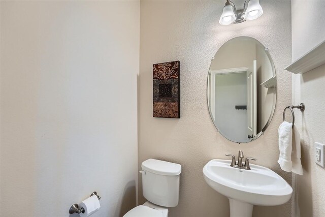 2712 Auburn Chestnut Ln, Pflugerville, TX 78660 - half bathroom with a sink and toilet