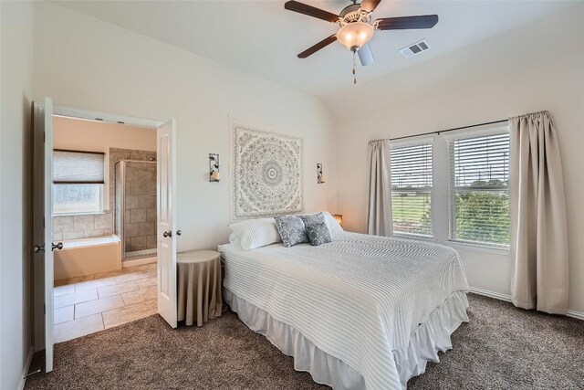 2712 Auburn Chestnut Ln, Pflugerville, TX 78660 - carpeted bedroom with baseboards, tile patterned flooring, ensuite bath, and a ceiling fan