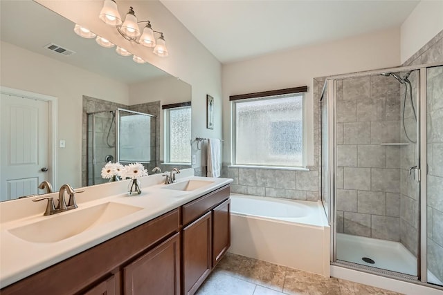 2712 Auburn Chestnut Ln, Pflugerville, TX 78660 - bathroom featuring a shower stall, double vanity, a bath, and tile patterned floors