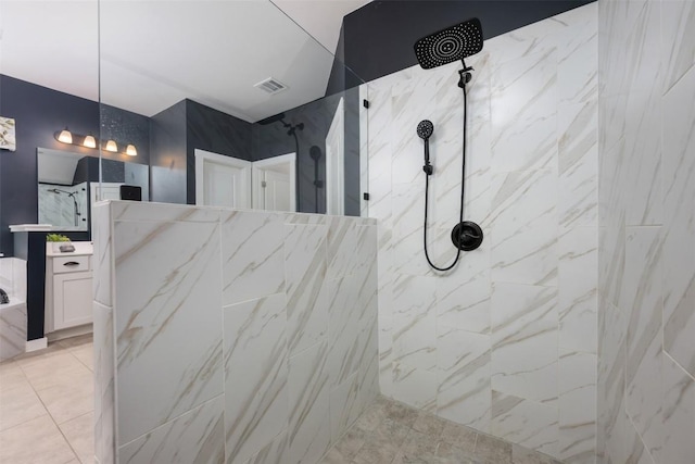 200 Wild Sage Ln, Liberty Hill, TX 78642 - bathroom with vanity, a marble finish shower, and tile patterned flooring