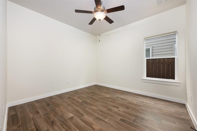 200 Wild Sage Ln, Liberty Hill, TX 78642 - spare room with wood finished floors, a ceiling fan, and baseboards