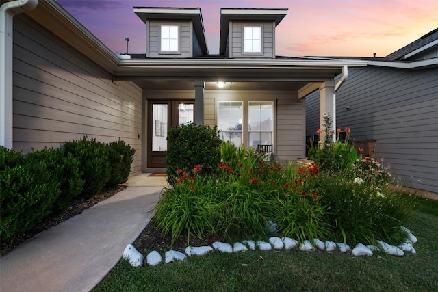 200 Wild Sage Ln, Liberty Hill, TX 78642 - exterior entry at dusk featuring a porch