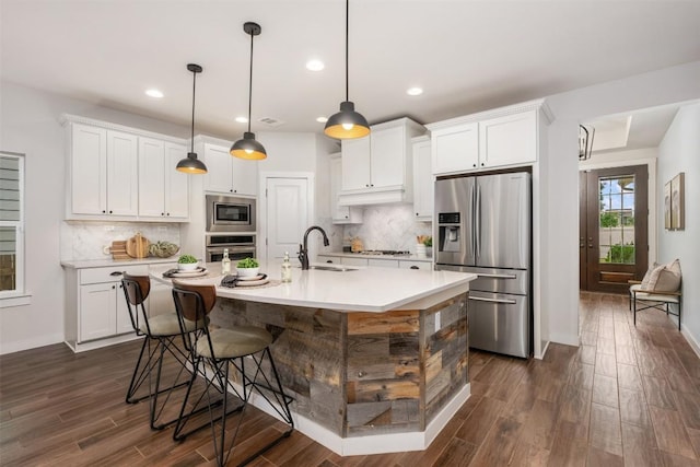 200 Wild Sage Ln, Liberty Hill, TX 78642 - kitchen with stainless steel appliances, a sink, white cabinetry, recessed lighting, and dark wood-style flooring