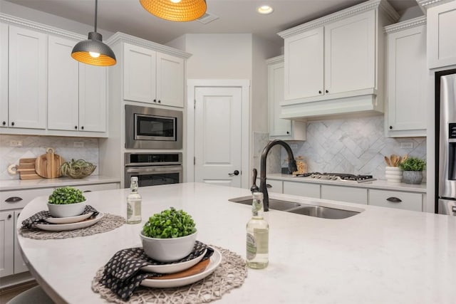 200 Wild Sage Ln, Liberty Hill, TX 78642 - kitchen with appliances with stainless steel finishes, a sink, light countertops, tasteful backsplash, and recessed lighting