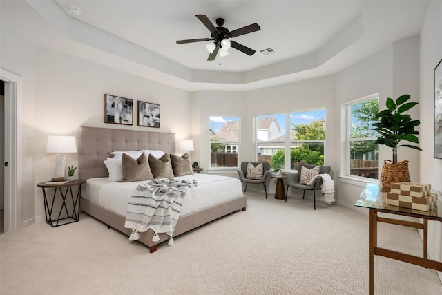 200 Wild Sage Ln, Liberty Hill, TX 78642 - carpeted bedroom featuring a raised ceiling and ceiling fan