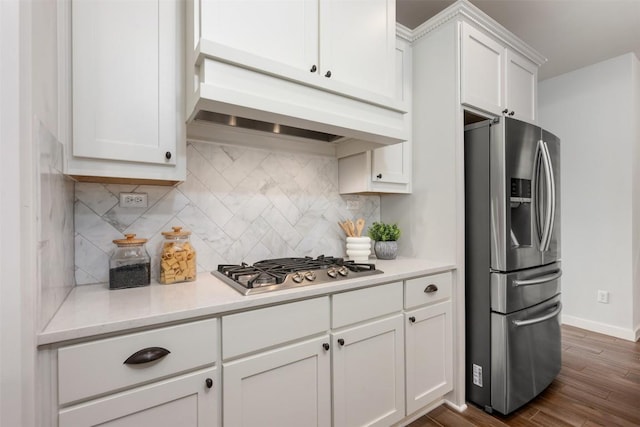200 Wild Sage Ln, Liberty Hill, TX 78642 - kitchen with stainless steel appliances, custom exhaust hood, light countertops, white cabinets, and backsplash