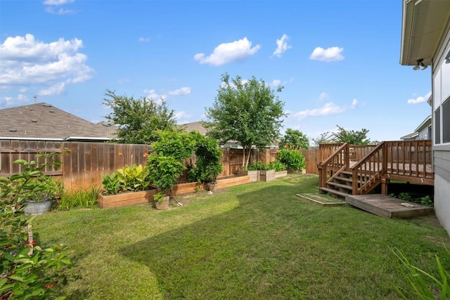 200 Wild Sage Ln, Liberty Hill, TX 78642 - view of yard featuring a vegetable garden and a wooden deck