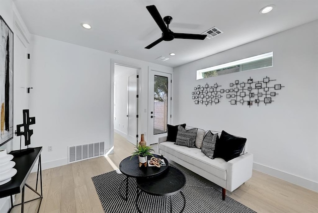 1117 Lawson Ln Unit 2, Austin, TX 78702 - living area featuring light wood-style floors, ceiling fan, recessed lighting, and baseboards